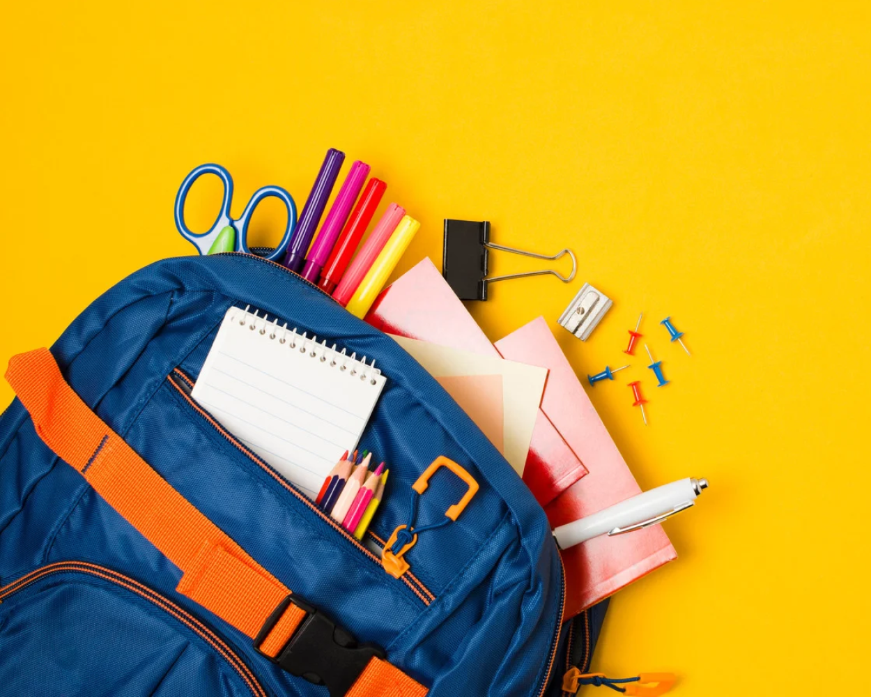 blue bag with school supplies